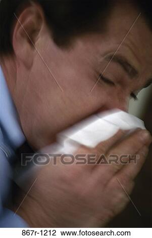 Stock Image - nose, cold, tissue, Middle-aged, illness, indoors. Fotosearch