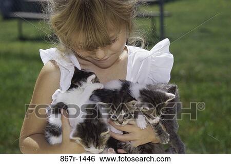 Stock Photograph - people, animals, pets, holding, girl, outdoors. Fotosearch