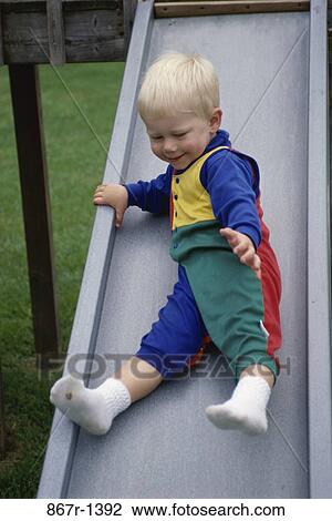 people, baby, toddler, sliding, boy, outdoors View Large Photo Image Stock Image - people, baby, toddler, sliding, boy, outdoors. Fotosearch