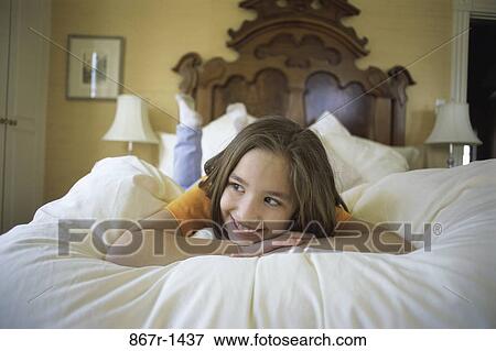 people, bed, girl, child, laying, brunette View Large Photo Image Stock Photo - people, bed, girl, child, laying, brunette. Fotosearch