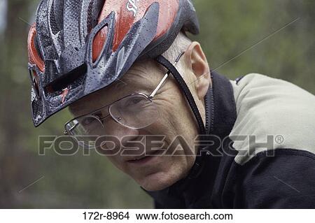 people, eyeglasses, senior, bicycle, helmet View Large Photo Image Picture - people, eyeglasses, senior, bicycle, helmet. Fotosearch