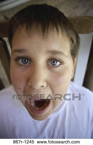 Stock Photography - people, faces, boy, child, brunette, indoors, headshot. Fotosearch