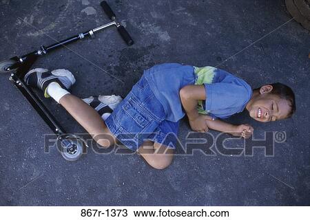 Stock Image - people, ground, injury, boy, outdoors, fall. Fotosearch