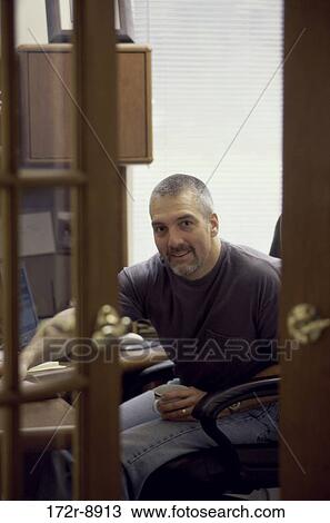 Stock Image - people, home, Middle-aged, office, indoors. Fotosearch