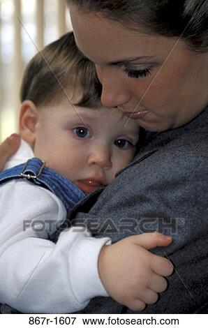 Stock Photo - people, mother, toddler, holding, nurturing, hugging, family. Fotosearch