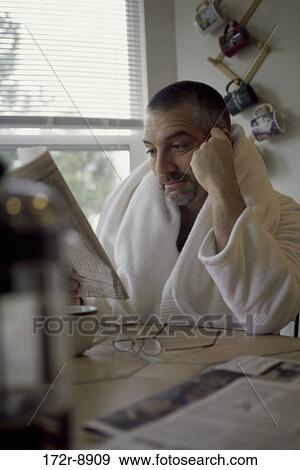 Stock Photo - people, newspaper, reading, Middle-aged, indoors. Fotosearch