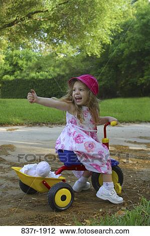people, smiling, playing, tricycle, riding, girl, outdoors View Large Photo Image Stock Image - people, smiling, playing, tricycle, riding, girl, outdoors. Fotosearch