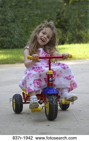 people, smiling, playing, tricycle, riding, girl, outdoors View Large Photo Image Stock Image - people, smiling, playing, tricycle, riding, girl, outdoors. Fotosearch