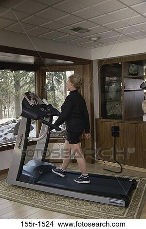 people, snow, home, woman, walking, window, magazine View Large Photo Image Picture - people, snow, home, woman, walking, window, magazine. Fotosearch