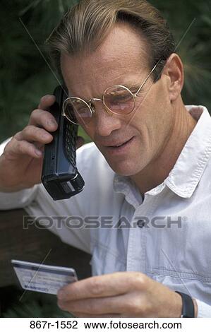 Stock Image - people, telephone, eyeglasses, phone, outdoors, Middle-aged. Fotosearch