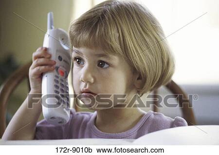 Stock Image - people, telephone, talking, listening, phone, holding, girl. Fotosearch
