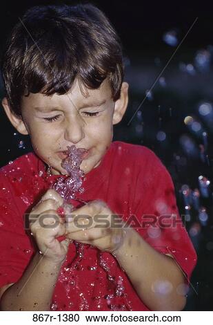 people, water, splash, boy, outdoors, balloon, child View Large Photo Image Stock Image - people, water, splash, boy, outdoors, balloon, child. Fotosearch