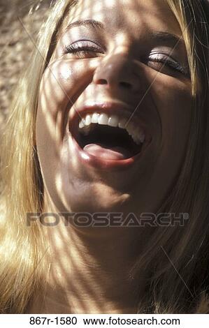 Stock Image - people, woman, smiling, face, laughing, amused, smile. Fotosearch