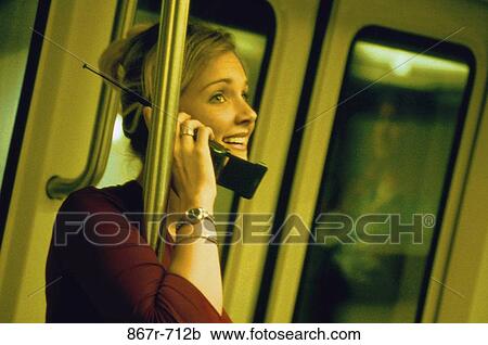 Stock Image - people, woman, telephone, talking, phone, cell phone, cell. Fotosearch