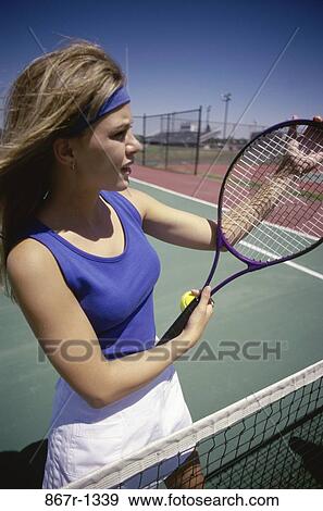 Stock Photo - people, woman, tennis, outdoors, court, brunette, Caucasian. Fotosearch