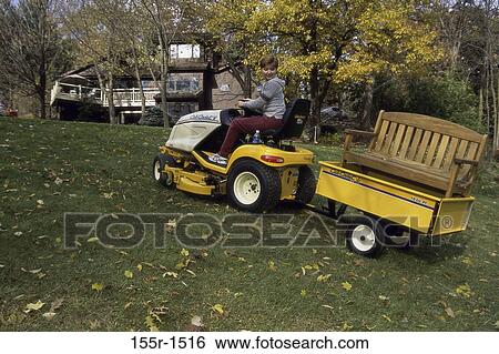 people, woman, tractor, gardening, outdoors, brunette View Large Photo Image Stock Photograph - people, woman, tractor, gardening, outdoors, brunette. Fotosearch