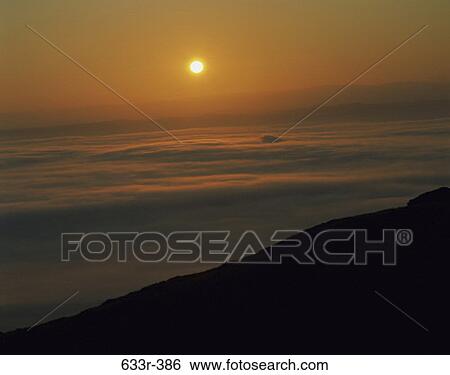Stock Photograph - sky, clouds, sun, sunset, land, nature. Fotosearch