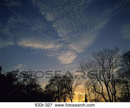 sky, floating, clouds, dusk, evening, sunset, setting View Large Photo Image Stock Photo - sky, floating, clouds, dusk, evening, sunset, setting. Fotosearch