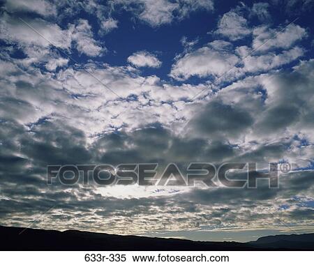 sky, floating, clouds, puffy, formations, land View Large Photo Image Stock Photography - sky, floating, clouds, puffy, formations, land. Fotosearch