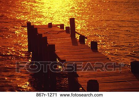 Stock Image - sunset, lake, nature, dock, sunrise, Outdoors man nature. Fotosearch