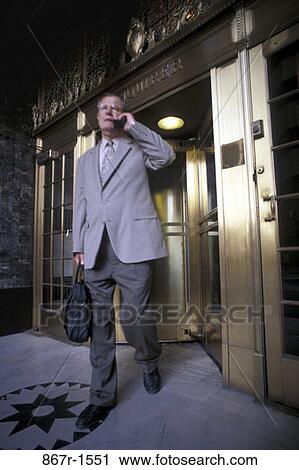 Stock Image - telephone, senior, phone, business, outdoors, Middle-aged, cell phone. Fotosearch