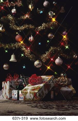 Stock Photo - tree, Christmas, decorations, gifts, presents, still life. Fotosearch