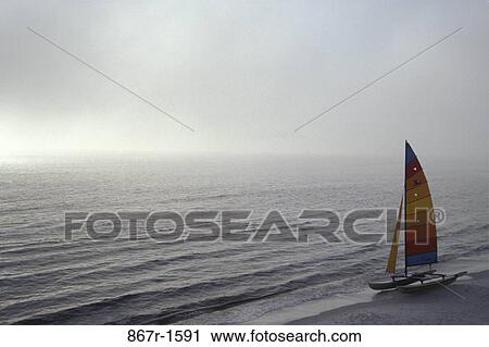 Stock Image - water, fog, beach, overcast, sports, water sports. Fotosearch
