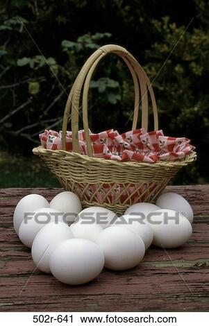 Stock Image - white, breakfast, basket, outdoors, foliage, food, still life. Fotosearch