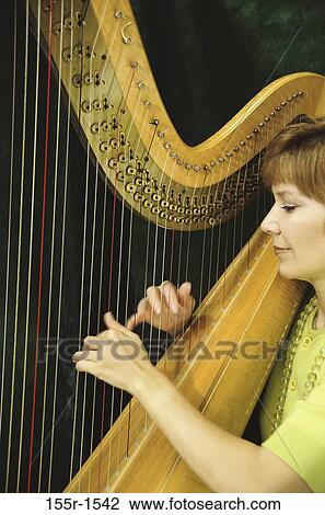 woman, playing, concentration, music, concentrating, arts, entertainment View Large Photo Image Stock Image - woman, playing, concentration, music, concentrating, arts, entertainment. Fotosearch