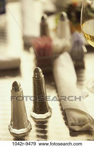Stock Photo - blur, glass, wine, salt, restaurant, pepper, shakers. Fotosearch