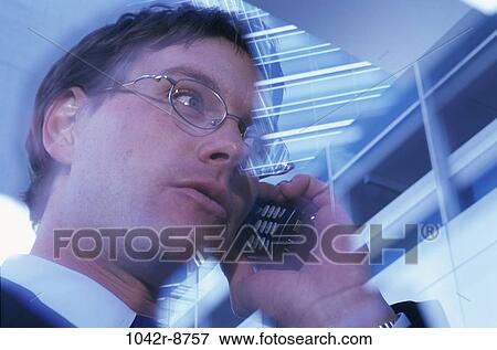 Stock Photo - blur, talking, eyeglasses, phone, business, Middle-aged. Fotosearch
