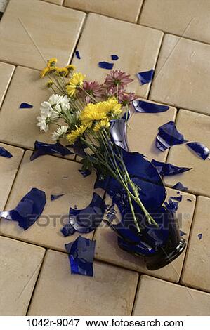 Stock Photo - broken, flowers, tiles, vase, still life, fallen, shattered. Fotosearch
