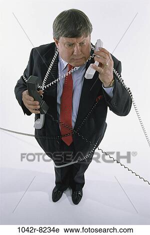 business, chaotic, Middle-aged, frustrated, humor, multi-tasking View Large Photo Image Stock Image - business, chaotic, Middle-aged, frustrated, humor, multi-tasking. Fotosearch