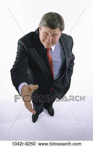 business, Middle-aged, businessman, handshake, indoors, Caucasian View Large Photo Image Stock Image - business, Middle-aged, businessman, handshake, indoors, Caucasian. Fotosearch