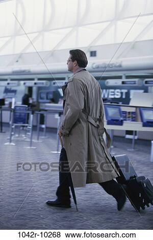 business, weather, businessman, indoors, travel, airport, Caucasian View Large Photo Image Stock Photo - business, weather, businessman, indoors, travel, airport, Caucasian. Fotosearch