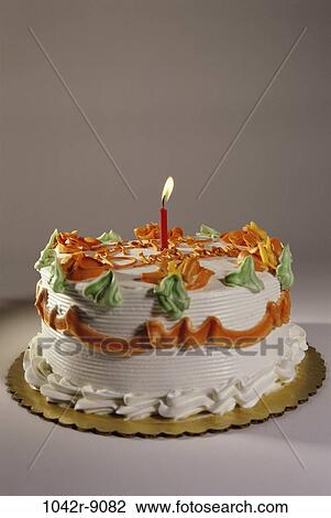 Stock Image - cake, decorated, birthday, lit, candle, food, still life. Fotosearch