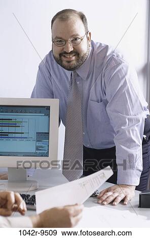 computer, business, Middle-aged, businessman, indoors, Caucasian View Large Photo Image Stock Photo - computer, business, Middle-aged, businessman, indoors, Caucasian. Fotosearch