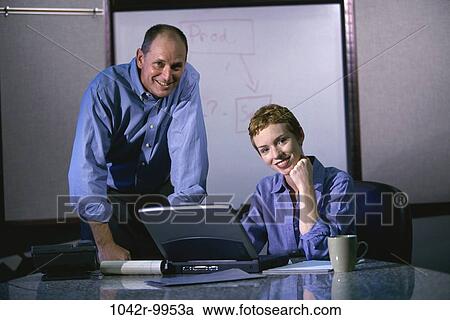 Stock Image - computer, laptop, business, using, casual, Caucasian, casual dress. Fotosearch