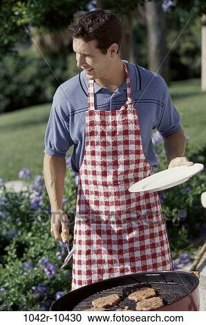 cooking, outdoors, food, apron, food preparation, brunette View Large Photo Image Stock Image - cooking, outdoors, food, apron, food preparation, brunette. Fotosearch