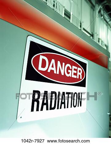 Stock Photo - danger, sign, radiation, pollution, warning, social issue, Signage uprights. Fotosearch