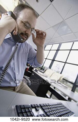 desk, telephone, glasses, talking, phone, business, Middle-aged View Large Photo Image Stock Image - desk, telephone, glasses, talking, phone, business, Middle-aged. Fotosearch