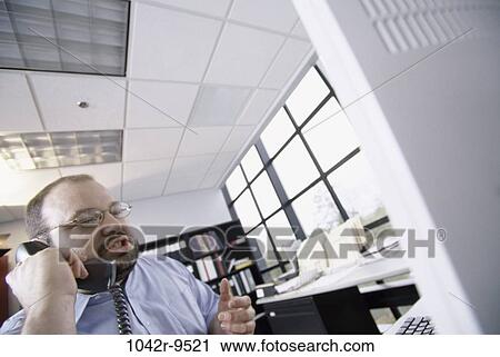 Stock Image - desk, telephone, talking, phone, business, businessman. Fotosearch