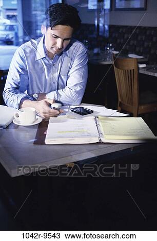Stock Image - dial, dialing, coffee, Hispanic, computer, phone. Fotosearch