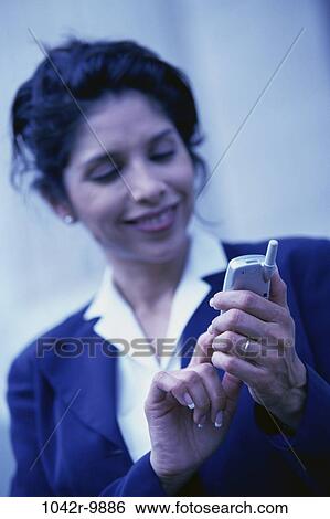 dial, dialing, woman, Hispanic, phone, business, outdoors View Large Photo Image Stock Photograph - dial, dialing, woman, Hispanic, phone, business, outdoors. Fotosearch
