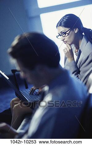eyeglasses, Hispanic, laptop, business, indoors, travel, businesspeople View Large Photo Image Stock Image - eyeglasses, Hispanic, laptop, business, indoors, travel, businesspeople. Fotosearch