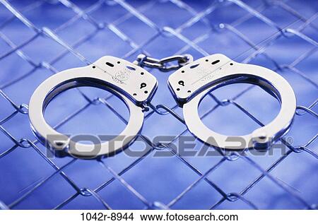 fence, law, still life, prison, crime, handcuffs, punishment View Large Photo Image Picture - fence, law, still life, prison, crime, handcuffs, punishment. Fotosearch