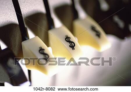 Stock Image - finance, still life, buttons, dollar, office equipment, adding machine. Fotosearch