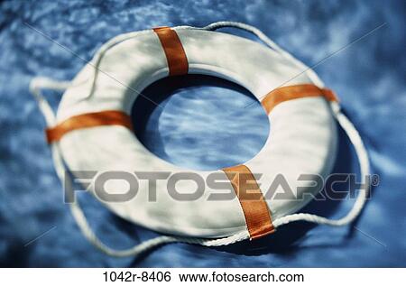 Stock Photograph - floating, water, pool, ring, survival, safety, rescue. Fotosearch