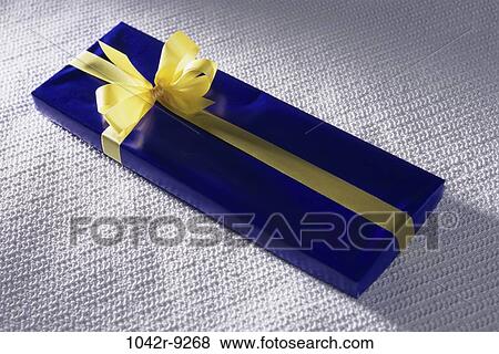 Stock Photo - gift, present, ribbon, long, still life, bow, holiday. Fotosearch