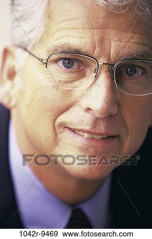Stock Photo - glasses, business, Middle-aged, businessman, Caucasian, businessmen headshots. Fotosearch